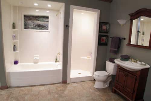 American Home Remodeling Bathroom remodel with Sentrel bath systems. Prefer a Shower-tub combo? Pictured is a bathtub and a small walk-in shower, that share a wall.