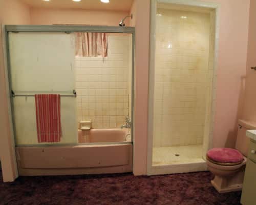 Another reason to remodel your bathroom. This restroom has a pink tub, with brown carpeting and pink walls. 