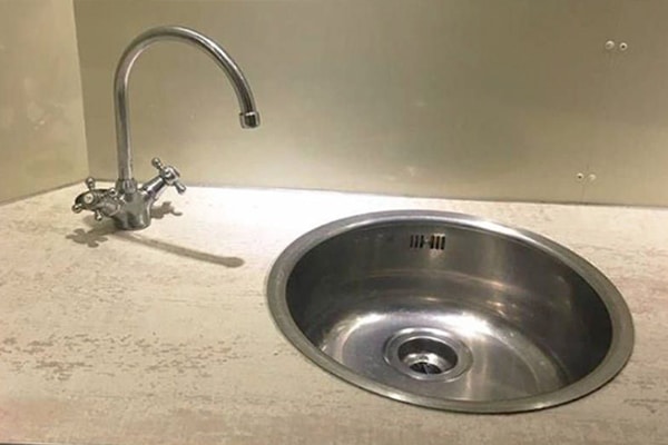 DIY bathroom remodeling - sink and faucet are about a foot apart.