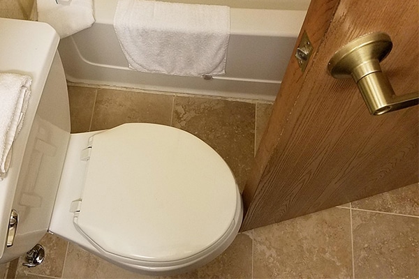 a common diy bathroom remodeling fail - the toilet blocks the door from opening fully. 