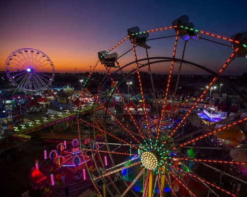 County Fairs and Home Shows: Orange County Fair Skyline with two Ferris wheels pictured 