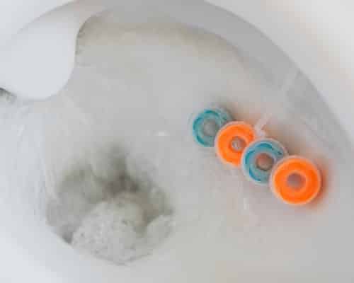 Keep your bathroom smelling fresh: Pictured here is a Toilet bowl with hanging cleaner rings. Great for keeping the toilet smell under control 