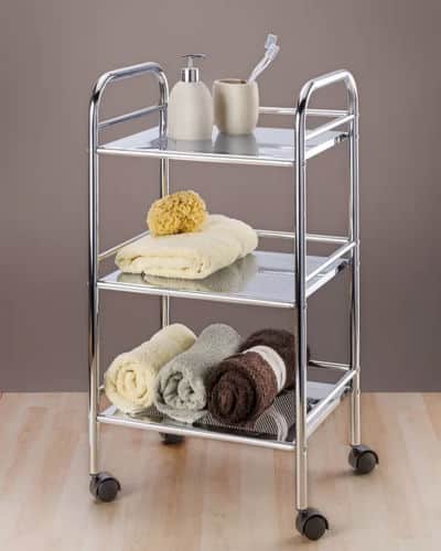 Easy Bathroom Storage Item: A chromed bathroom rolling cart with towels and bathroom décor placed on the shelves. 