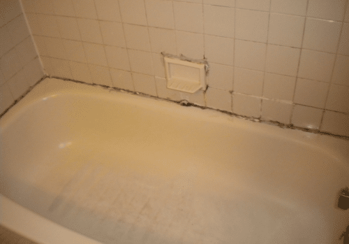 A picture of a stained tub in need of a remodel